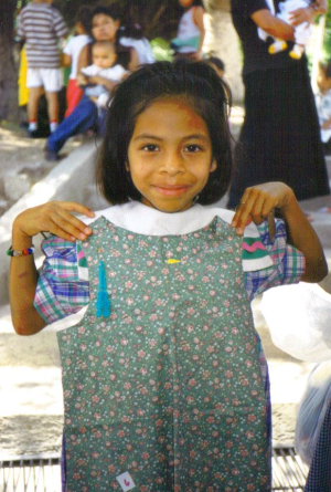 sewing Honduran girl